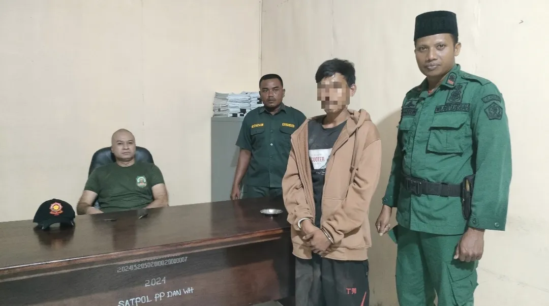 Foto: Pria Pemburu Babi Asal Sumut Saat Diamankan WH Aceh Utara